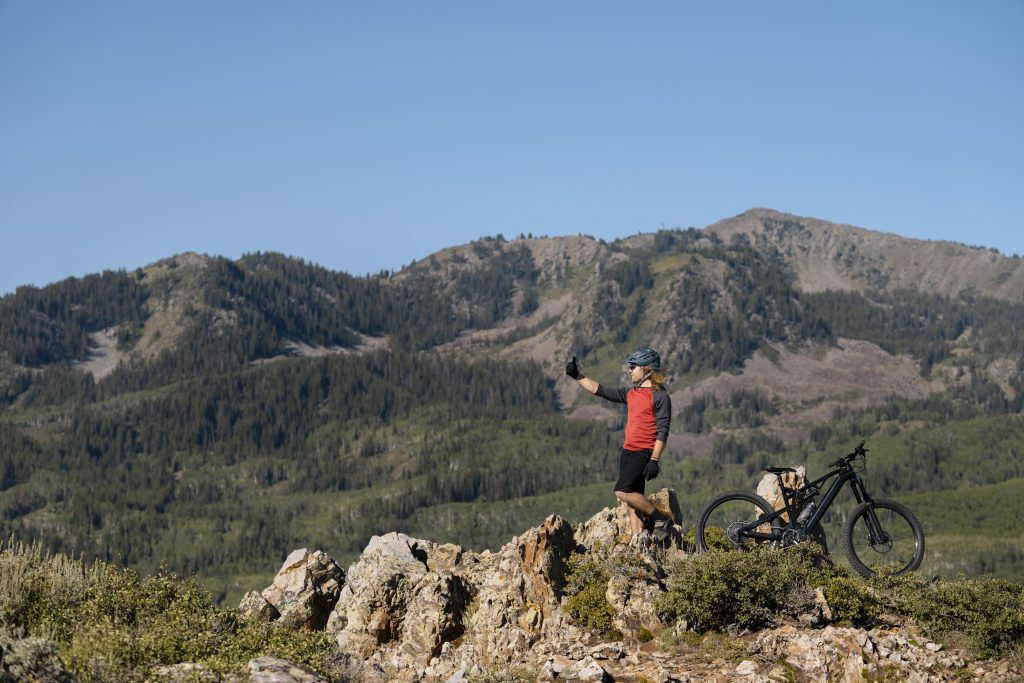 young adult using electric bike country side