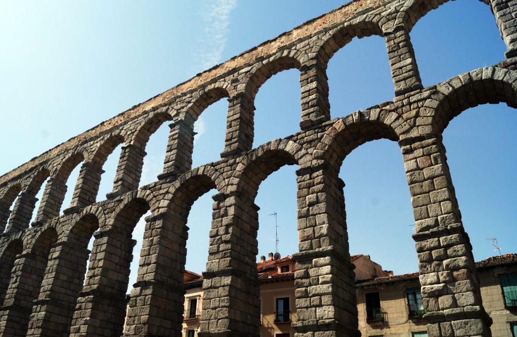 Bottom view shot of Aqueduct of Segovia in Segovia, Spain